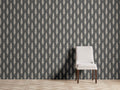 Gen??vrier Wallpaper with green arboreal pattern on white background; features straight match design. Chair shown for scale.