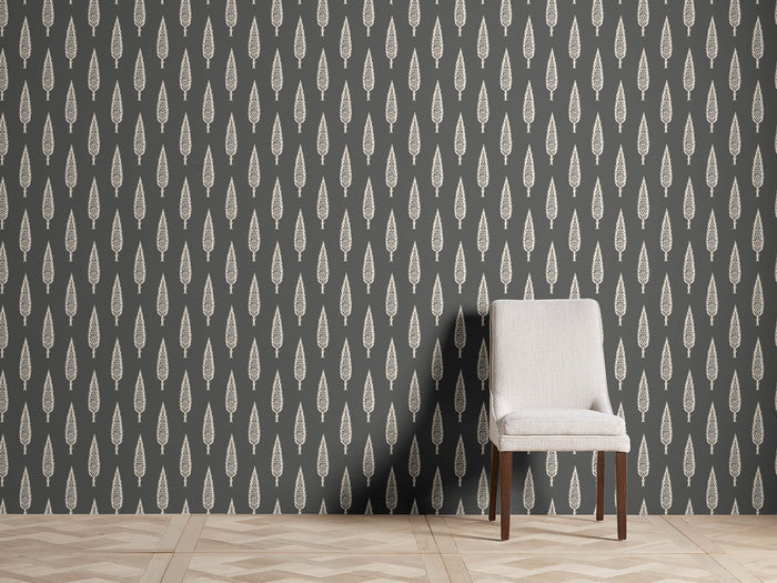 Gen??vrier Wallpaper with green arboreal pattern on white background; features straight match design. Chair shown for scale.