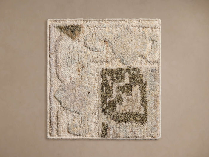 Gia Hand-Knotted Rug Swatch displaying a textured surface with neutral tones and abstract design elements.
