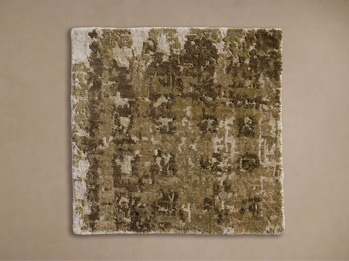Square Grafton Hand-Knotted Rug Swatch with a textured, abstract pattern in olive green, brown, and beige, viewed from above.