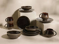 Chocolate and mocha Hearthline Dinnerware With Cereal Bowls (Set of 16), featuring reactive glaze mugs, bowls, and plates.