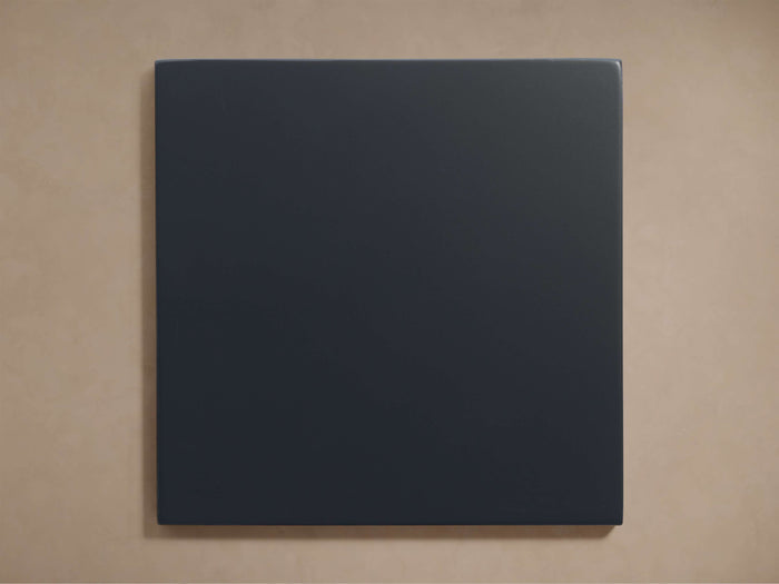 Black square Henley Eclipse Finish Board with smooth texture, centered against a beige background. No visible design elements.
