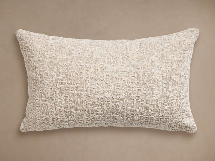 Inslee Outdoor Lumbar Pillow. Off-white, rectangular, with textured chenille abstract crosshatch pattern, shown horizontally.