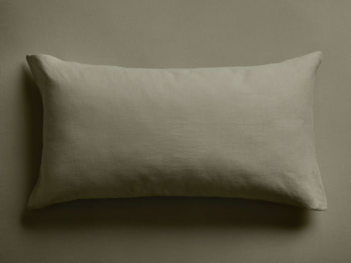 Sage green Italian Garment-Dyed Linen Sham, rectangular, with a soft, relaxed texture, lying flat on a matching surface.