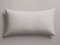 Natural Italian Garment-Dyed Percale King Sham, lying flat horizontally. Soft, light greyish-white fabric with subtle edge stitching.