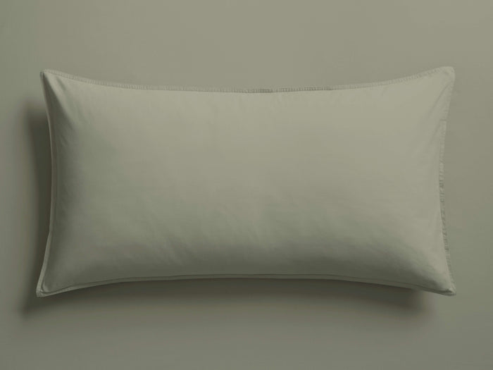 Italian Garment-Dyed Percale Sham in a soft sage green, lying flat, showcasing its clean lines and subtle texture.