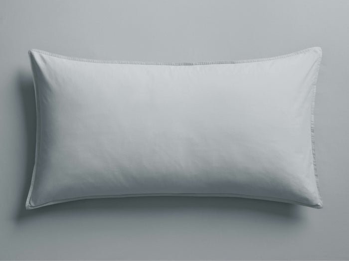 Light sky blue Italian Garment-Dyed Percale Sham, a rectangular pillow with subtle wrinkles and visible stitched knife-edge hem.