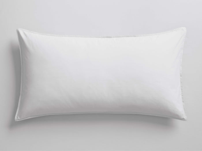 White Italian Garment-Dyed Percale Sham, a rectangular pillow cover, shown horizontally with a smooth, slightly rumpled texture and knife-edge seams.