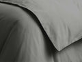 Close-up of charcoal Italian Garment-Dyed Sateen Duvet. Soft, draped fabric displays a subtle sheen & gentle, natural folds.