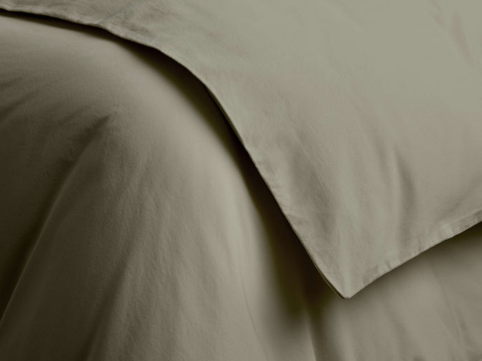 Close-up of a draped Italian Garment-Dyed Sateen Duvet in a muted olive green, showing soft folds and subtle sheen.