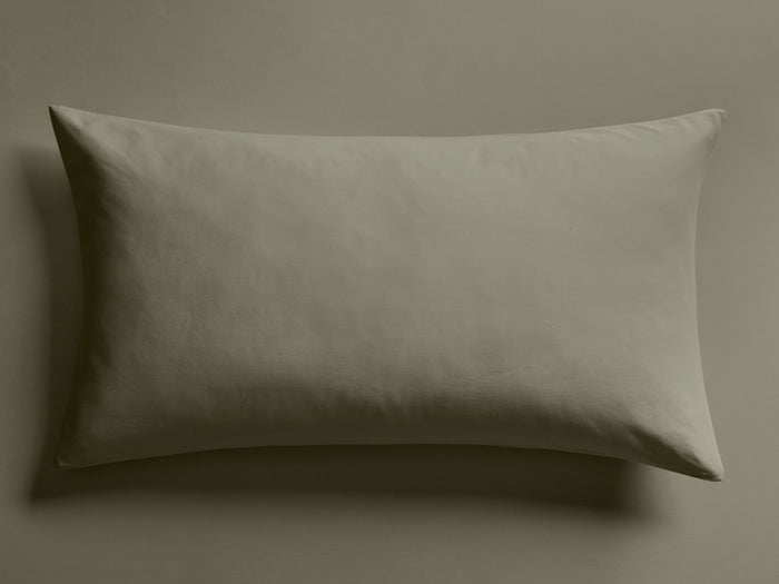 Italian Garment-Dyed Sateen Sham in muted sage green, lying flat, showcasing its silky, subtly-sheened fabric.
