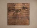 Wade Finish Board: A square sample of rich brown wood, showcasing natural grain patterns, dark knots, and varied hues.