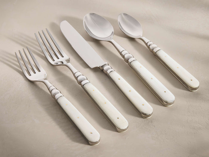 Front view of the Jimena Five Piece Place Setting, featuring polished stainless steel flatware with natural cream bone handles.