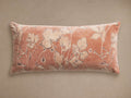 Kaylan embroidered botanical lumbar pillow; dusty rose velvet with raised light peach floral embroidery on a neutral background.