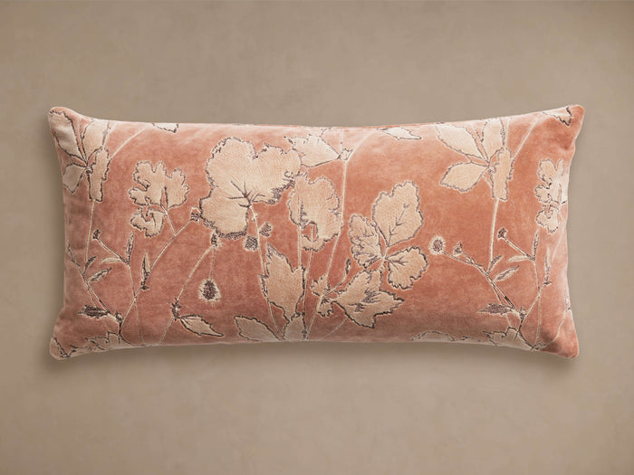 Kaylan embroidered botanical lumbar pillow; dusty rose velvet with raised light peach floral embroidery on a neutral background.