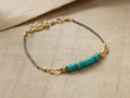 Kelby Bracelet: Turquoise disc beads, gold vermeil beads, oxidized silver chain, and gold shepherd's hook closure on fabric.