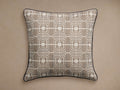 Kimble Pillow Cover, square, white with dark brown geometric pattern, black corded piping, on a beige background.