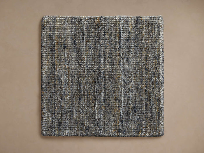 Lassen Handwoven Rug Swatch, square, flat lay. Features textured charcoal, grey, white, and tan woven fibers.