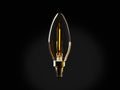 Front view of a clear, glowing candle-shaped LED filament bulb with a warm yellow light and brass screw base.