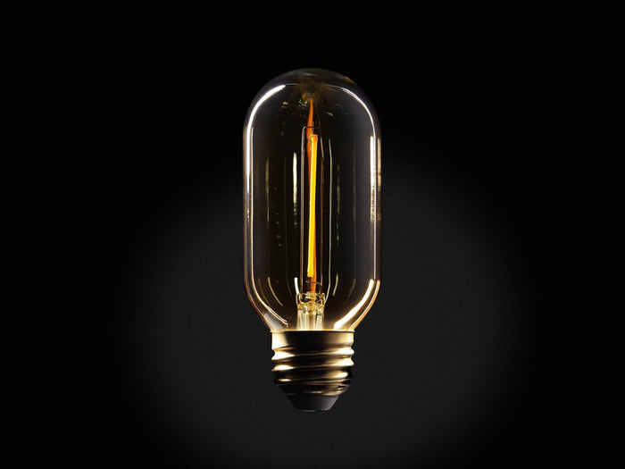 Amber glass LED T14 bulb with visible one-line filament. E26 base, dimmable. Emits warm glow, displayed against dark background.