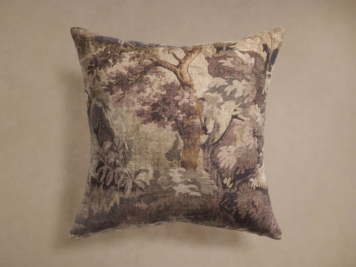 Square Lento Pillow with muted floral-botanical pattern in browns, beige, and purple, centered against a plain taupe background.