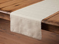 Linen Table Runner on a wooden table, featuring a beige color, rectangular shape, handwoven texture, and frayed edges.