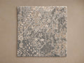 Luca Hand-Knotted Rug Swatch showcasing a blend of gray and beige tones with a textured, abstract pattern against a neutral background.