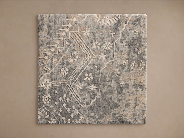 Luca Hand-Knotted Rug Swatch showcasing a blend of gray and beige tones with a textured, abstract pattern against a neutral background.