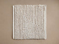Maddux Performance Rug Swatch in Natural, rectangular, textured off-white and natural beige geometric striped pattern, flat lay.