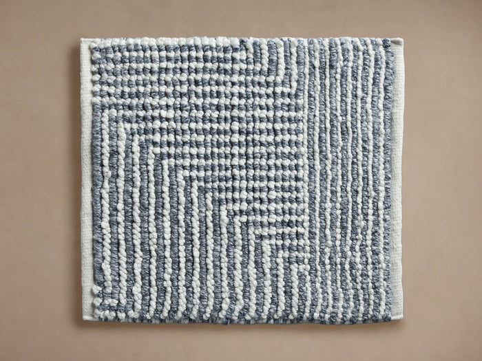 Maddux Performance Rug Swatch: Blue-grey and white textured geometric pattern with thick stripes, seen flat.