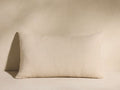 Horizontal Madera Alpaca Stripe Pillow, light beige, with a subtle woven chevron pattern, on a light surface.