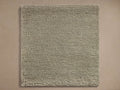 Square Maise Wool and Cashmere Hand-Knotted Rug Swatch in light sage green, showing dense, looped texture.