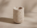 Mariyna Tumbler: Upright cylindrical tumbler crafted from natural, beige-toned marble with unique veining.