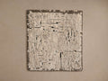Mckenna Hand-Knotted Rug Swatch featuring a textured, mottled pattern in various shades of beige and gray, displayed on a neutral background.
