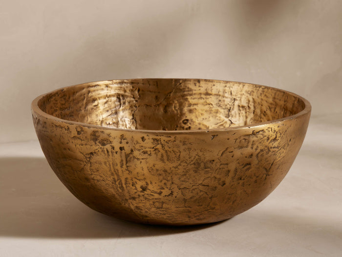 Harper Bowl, round, golden brass-finished bowl with heavily textured, distressed surface, shown from front.