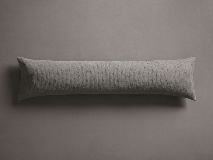 Light grey Mihali Matelasse Lumbar Pillow Cover with boucl?? striped texture, horizontally centered on a plain grey surface.