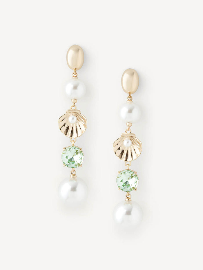 A pair of gold drop earrings featuring a gold oval stud, a white pearl, a gold scalloped shell charm, a round light green gemstone, and a dangling white pearl, shown on a light off-white background.