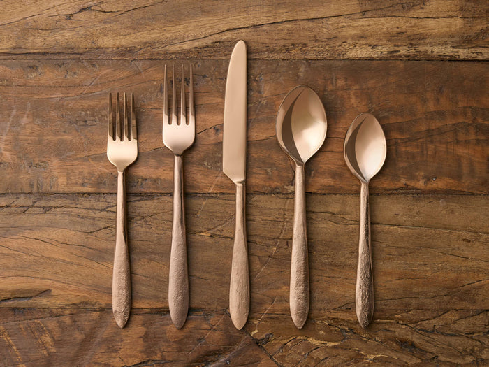 Murray Five Piece Place Setting in gold finish features a knife, two forks, and two spoons with tapered handles on wood surface.