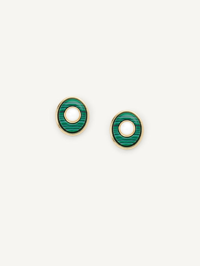Gold earrings with blue gemstones on a white background