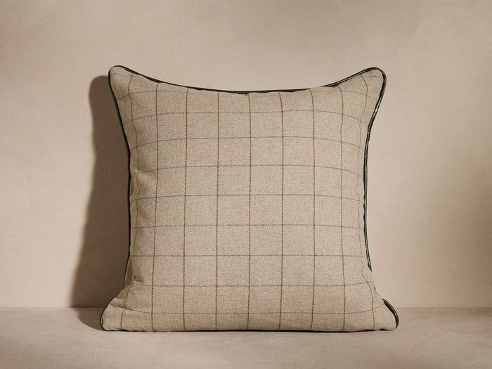 Northgate Piped Pillow with mocha-toned geometric pattern, black piping edges, and light beige grid design, against a neutral background.