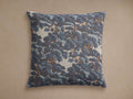 Square Oaks Pillow with a dense blue foliage and brown tree pattern on a light background, lying flat.