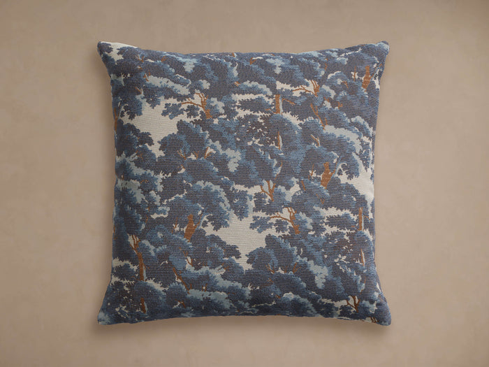 Square Oaks Pillow with a dense blue foliage and brown tree pattern on a light background, lying flat.