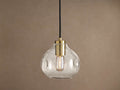 Organic 8" Pendant: Clear, seeded mouth-blown glass shade with brass hardware, black cord, and a glowing Edison bulb.