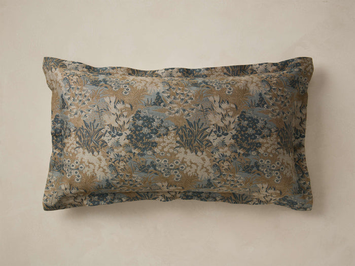 Front view of the Orlane Sham featuring a blue, brown, and cream jacquard woven botanical pattern.