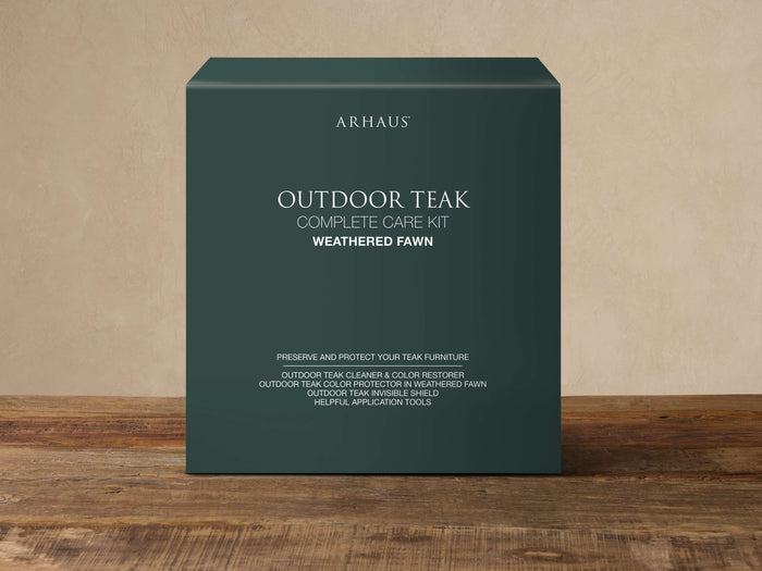 Outdoor Weathered Fawn Care Kit in a dark teal box with white text, on a light background and wooden surface.