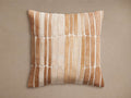 Pieced Hair on Hide Pillow with a mosaic of varying tan and brown oblong hair-on-hide patches, primarily arranged vertically.