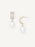 Pair of pearl drop earrings with gold accents on a white background
