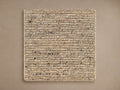 Square Ranna Rug Swatch. Coarse, flat woven natural fibers in beige, tan, brown, and black flecks on a neutral background.