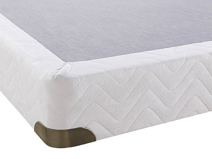 Retreat 8" Box Spring with white zigzag-patterned fabric and metal corner guards, shown from a corner angle.