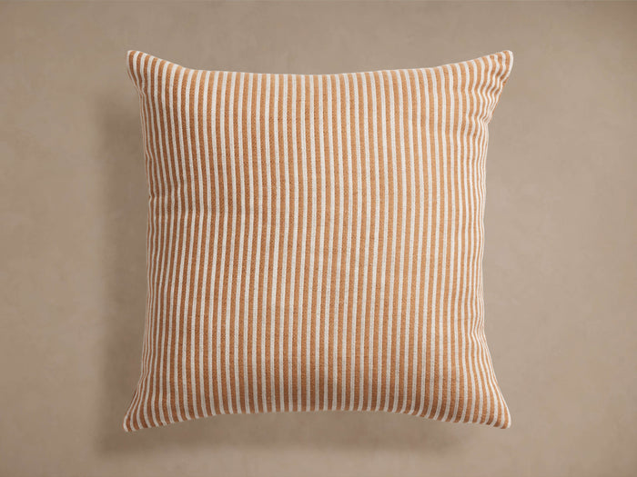 Ruoti Pillow, square, with bold vertical stripes in warm brown and off-white, centered on a neutral background.